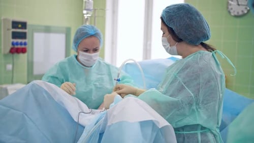 Surgeons Performing Operation in Hospital Operating Room