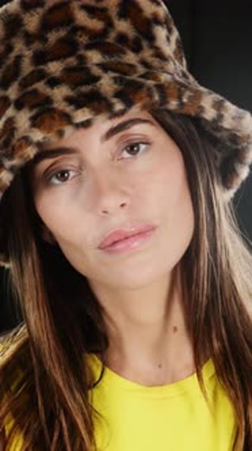 Young Woman Wearing Fashionable Leopard Print Hat