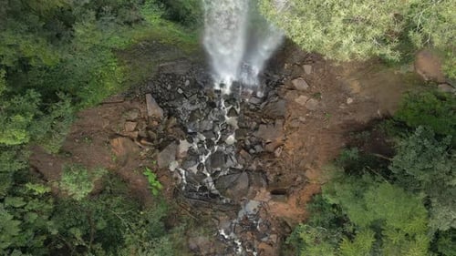 Water Splash On The Rocky Bottom Of Waterfalls In Brazil In The Midst Of Wilderness. - aerial shot