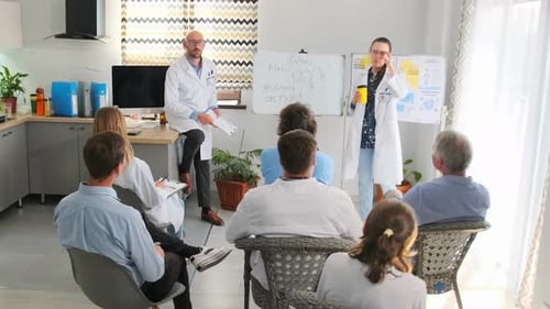 Doctors in classroom presentation on medical research