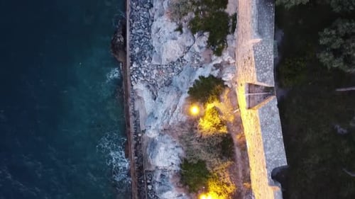 bird's eye view of the castle and the rocky view where the sea meets
