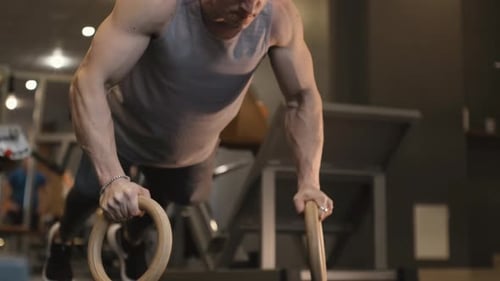 Strong Athlete Doing Push Up Exercise in Gym