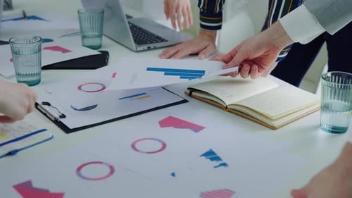 Close Up of Corporate Team Analyzing Financial Charts