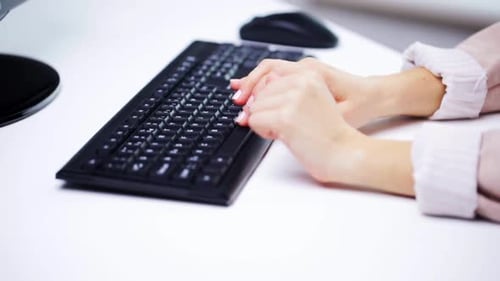 Business, People And Technology Concept - Young Businesswoman With Computer Typing At Office