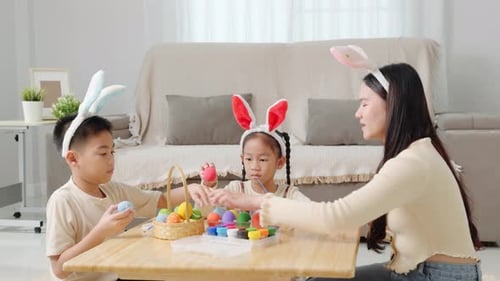 Easter Memories A Mother and Child Celebrate Easter By Painting Eggs in Colorful Shades
