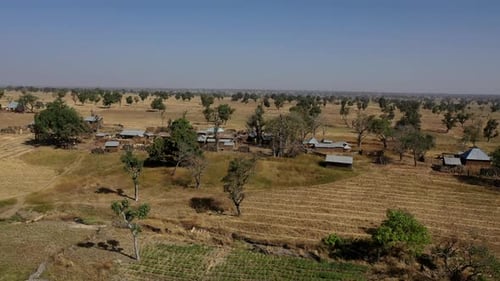 Farming village in Africa during a drought year in the dry season - aerial view of the arid landscap