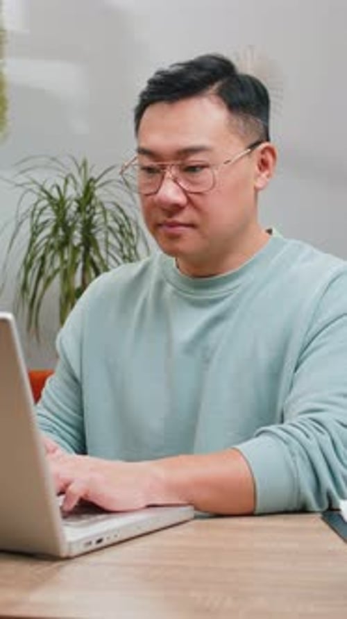 Man working on a laptop at a desk