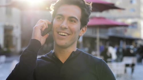 Man Talking on Mobile Phone Outside