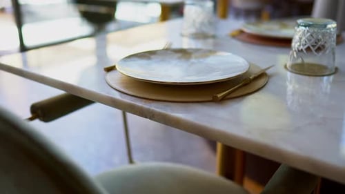 Front view of stylish and light dining table in restaurant close up shot
