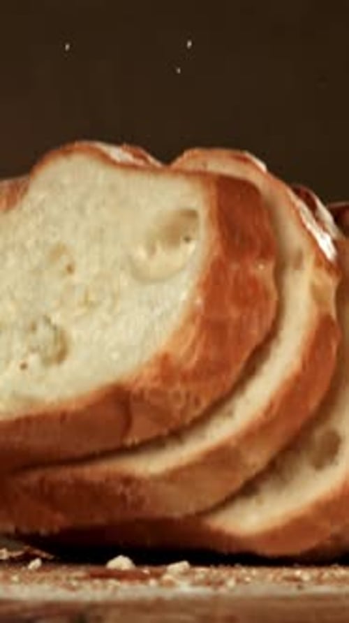 Sliced Bread Falls Onto a Cutting Board Filmed on a Highspeed Camera at 1000 Fps