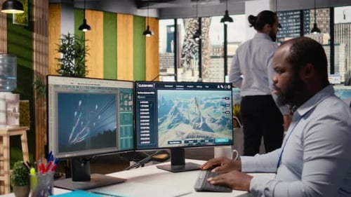 Employee Using Electric Grid with Wind Farm Layout Modeling Software