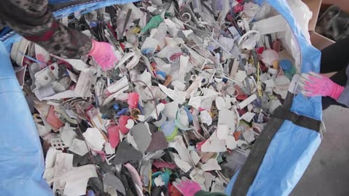 Ocean Plastic Clean-up; Hands Sorting Through Large Container Filled With Plastic Litter.