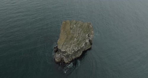 Aerial view of a rock in the sea, Iceland.
