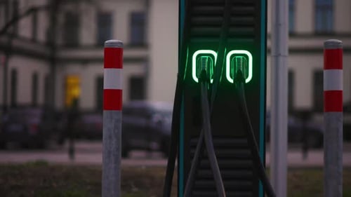 Vehicle Charging at a City Buildings Automotive Station