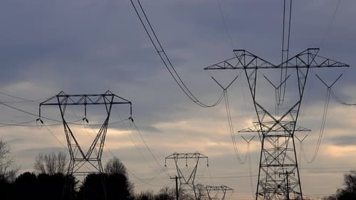 Electricity Pylons Against Colorful Evening Sky