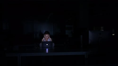 Tired Business Woman Working Late Indoors in Office at Night