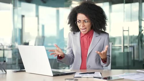 Frustrated Woman Facing Computer Problems in Bright Office
