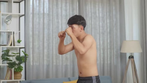 Asian Teenager Boy Boxing Warm Up While Doing Shirtless Workout At Home