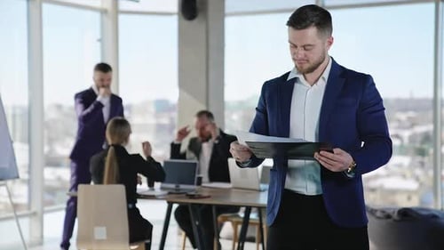 Happy Businessman Receives Good News at Modern Office