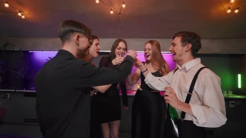 Friends Celebrating with Champagne at a Party