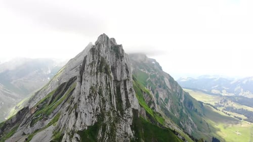 Aerial flyover around Altenalpturm peak at the Schafler ridge in Appenzell, Switzerland