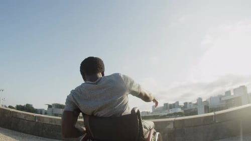 Young Adult in Wheelchair Moving to the Music