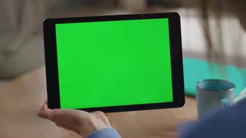 Woman Interacts With Tablet With Green Screen