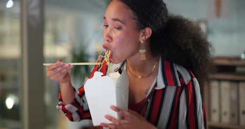 Woman Enjoying Noodle Takeout at Office Desk