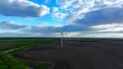 Wind Turbines Against The Open Field