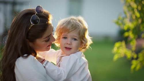 Loving Mother and Child Embrace in Golden Light