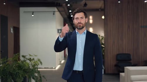 Business Man Thumbs Up in Modern Office Setting