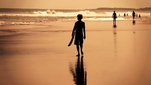 Silhouette of Man with Surfing Board Walking on Beach Super