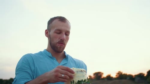 Happy Family with Baby Celebrate First Year Eat Cake in Field at Sunset Autumn and Lifestyle