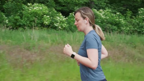 Woman jogging on running track at sport stadium
