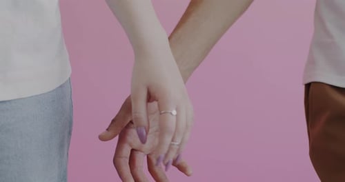Close Up of Couple Holding Hands Tenderly