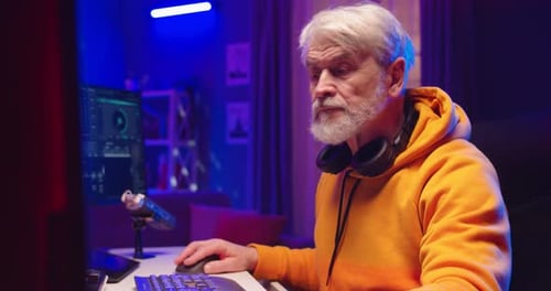 Close Up of Busy Caucasian Stylish Old Man Dj Mixing on Vinyl Plate Streaming Live Playing Music at