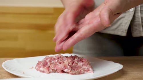 Preparing Meatballs: Shaping Raw Ground Meat Close-Up