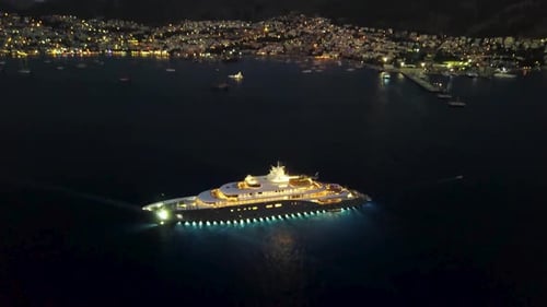Night drone view of luxury yacht in Bodrum sea
