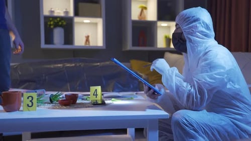 Forensic Investigator Examines Crime Scene Evidence at Night