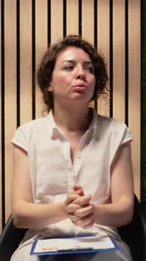 Vertical Video Anxious Female Job Candidate Waiting in the Queue Under Pressure