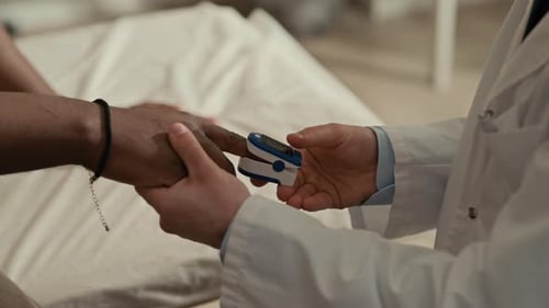 Doctor Measuring Blood Oxygen Levels