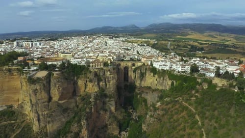 Experience stunning cliff views and charming buildings in Ronda, Spain