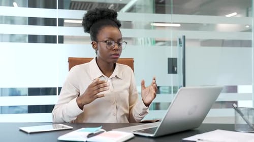 Businesswoman Engaged in a Video Conference at Work