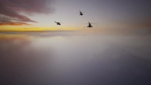 Three Military Helicopters Flying Through Dramatic Cloudy Sky