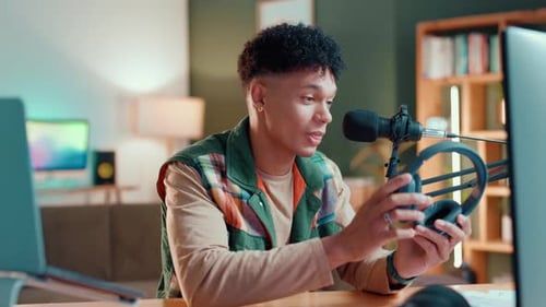 Streamer, microphone and headphones with man in studio for review, tech advice or advertising