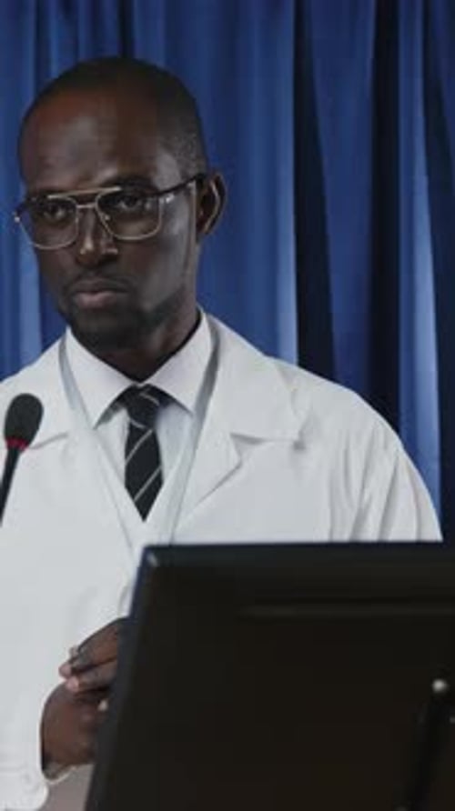 Doctor or Scientist Presenting at Podium