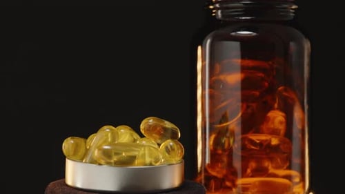 Rotating Close Up of Golden Vitamin Capsules