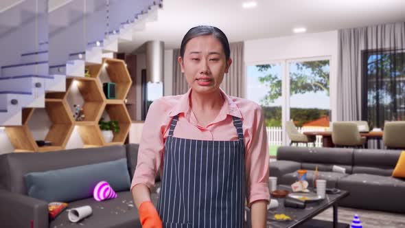 Angry Asian Female Housekeeper With An Apron Pointing And Shouting To ...