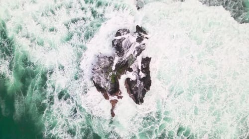 Top View Beautiful Sea with Large Oceanic Wave Crashing on Rocks