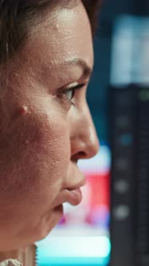 Woman Working on Computer Screen at Night